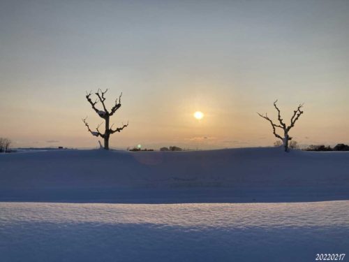 雪景色の夕陽